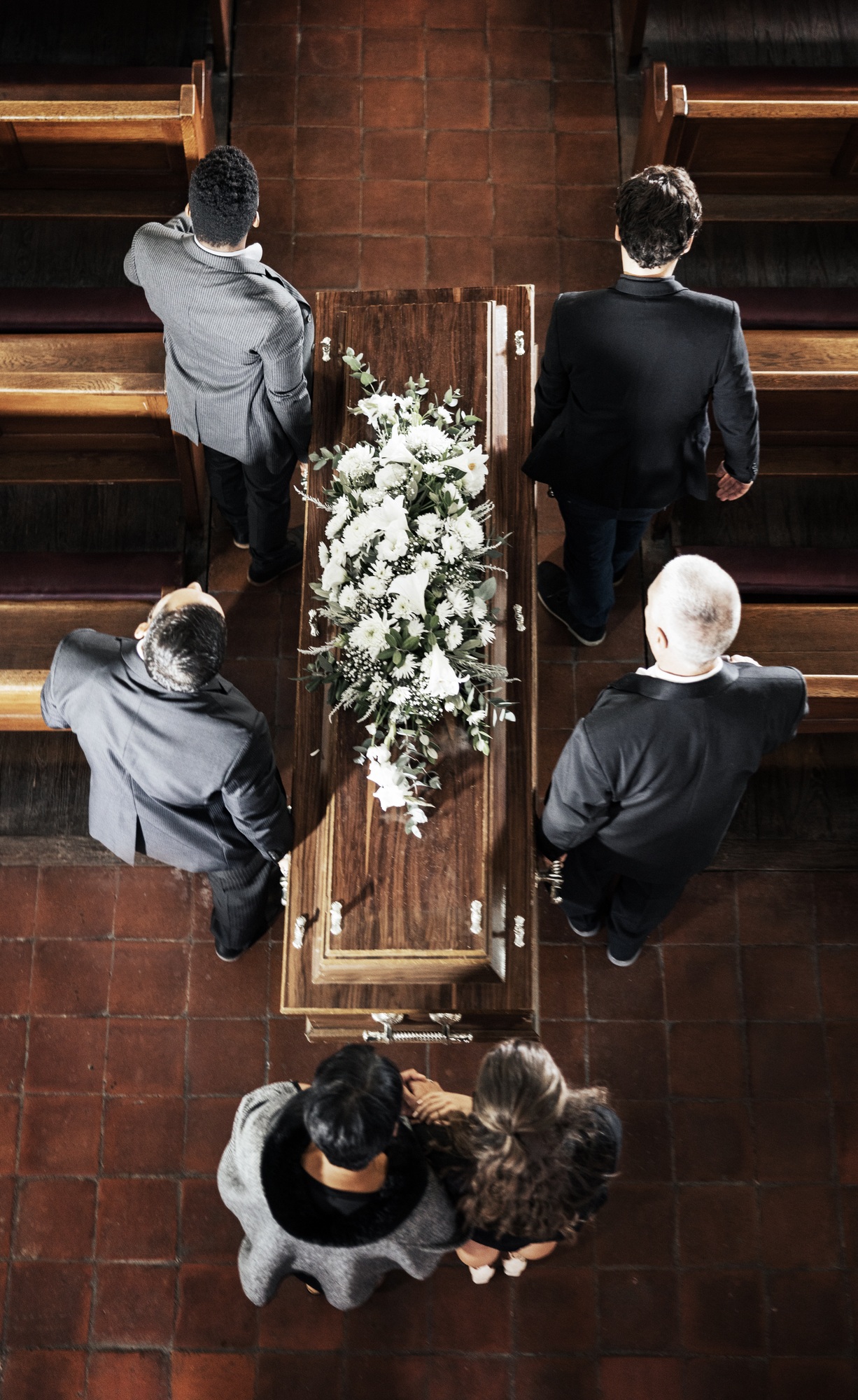Funeral, coffin and family mourning death of loved one, death and carrying wood casket in church fo